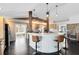 Open kitchen with bar seating, updated cabinetry, and view into sunroom at 132 Alachua Dr, Winter Haven, FL 33884