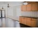 Bright living space featuring dark wood floors, cabinets, black countertops, and stylish backsplash at 132 Alachua Dr, Winter Haven, FL 33884