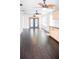 Bright living space featuring dark wood floors, cabinets, black countertops, and stylish backsplash at 132 Alachua Dr, Winter Haven, FL 33884