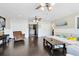 Open living area featuring dark wood floors, a comfortable sofa, and a view into the bathroom at 132 Alachua Dr, Winter Haven, FL 33884