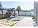 Large backyard featuring a covered gazebo, string lights, partial synthetic grass, and concrete paver design at 184 Lake Smart Cir, Winter Haven, FL 33881