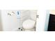 A well-lit bathroom featuring a toilet and convenient storage rack at 184 Lake Smart Cir, Winter Haven, FL 33881
