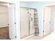 Bathroom with blue walls featuring a shower, glass door, and decorative shower curtain at 184 Lake Smart Cir, Winter Haven, FL 33881