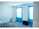 Bedroom with neutral carpet and blue window dressings at 184 Lake Smart Cir, Winter Haven, FL 33881