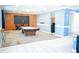 Open game room with pool table, wood accent wall, and seamless flow to adjacent areas at 184 Lake Smart Cir, Winter Haven, FL 33881