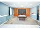 Large game room featuring a pool table, wood accent wall, and ample space for entertainment at 184 Lake Smart Cir, Winter Haven, FL 33881