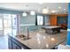 Spacious game room with a granite island, pool table and sliding glass door at 184 Lake Smart Cir, Winter Haven, FL 33881