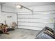 Uncluttered garage with a new garage door and concrete flooring at 184 Lake Smart Cir, Winter Haven, FL 33881