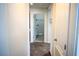 Neutral hallway providing a view to a bathroom at 184 Lake Smart Cir, Winter Haven, FL 33881