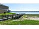 Community boardwalk with lake and home view at 184 Lake Smart Cir, Winter Haven, FL 33881