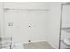 Bright laundry room with tile flooring, shelving, and hookups, ready for appliances at 184 Lake Smart Cir, Winter Haven, FL 33881