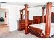 Bedroom featuring neutral carpet and furnished with luxurious wood furniture at 184 Lake Smart Cir, Winter Haven, FL 33881