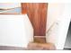 Staircase leading down, complemented by unique wood paneling on the adjacent wall at 184 Lake Smart Cir, Winter Haven, FL 33881