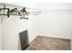 Carpeted walk-in closet with clothes hanging on the metal closet rod at 184 Lake Smart Cir, Winter Haven, FL 33881