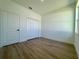 Bedroom showcasing luxury vinyl plank flooring, closet and bright light at 4295 Nw 1St Court Rd, Ocala, FL 34475