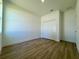 Bedroom features luxury vinyl plank flooring, bright light and bi-fold closet at 4295 Nw 1St Court Rd, Ocala, FL 34475