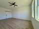 Bright bedroom with luxury vinyl flooring, sliding barn door, and ample natural light at 4295 Nw 1St Court Rd, Ocala, FL 34475