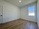 Bright bedroom with clean white walls, luxury vinyl plank flooring, and natural light at 4295 Nw 1St Court Rd, Ocala, FL 34475
