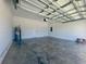 Spacious two-car garage featuring painted walls and high ceilings at 4295 Nw 1St Court Rd, Ocala, FL 34475