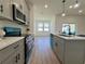 Well-lit kitchen showcasing gray cabinets, white countertops, and stainless steel appliances at 4295 Nw 1St Court Rd, Ocala, FL 34475