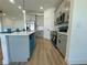 Contemporary kitchen with gray cabinets, stainless steel appliances, and a stylish island at 4295 Nw 1St Court Rd, Ocala, FL 34475