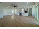 Open-concept living area showcasing wood flooring, modern lighting, and ample natural light at 4295 Nw 1St Court Rd, Ocala, FL 34475