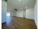 Open-concept living room featuring luxury vinyl floors and a modern ceiling fan at 4295 Nw 1St Court Rd, Ocala, FL 34475