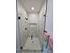Contemporary shower with glass enclosure, neutral tile, and matte black fixtures at 4295 Nw 1St Court Rd, Ocala, FL 34475