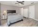 Cozy main bedroom with neutral decor, a comfortable bed, and ample closet space at 490 Burnt Tree Ln, Apopka, FL 32712