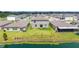 Aerial view of the backyard with lush lawn and tranquil pond at 5553 Turkey Creek Way, Lakeland, FL 33811