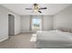 Neutral bedroom with light-colored carpet, window, and ceiling fan at 5553 Turkey Creek Way, Lakeland, FL 33811