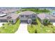 Inviting two-story home featuring a well-manicured lawn and a scenic view of the surrounding community at 5553 Turkey Creek Way, Lakeland, FL 33811