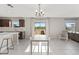 Well-equipped kitchen featuring dark cabinets, a kitchen island with seating, and ample counter space at 5553 Turkey Creek Way, Lakeland, FL 33811