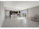 Open living space with a view of the kitchen features tile floors and a door that leads to the outside at 5553 Turkey Creek Way, Lakeland, FL 33811