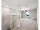 Upstairs loft area with neutral walls, carpet flooring, ceiling fan, and a bright window at 5553 Turkey Creek Way, Lakeland, FL 33811