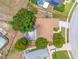 Aerial view showcasing a home with a screened-in pool and mature trees, with a red boundary line showing the property lines at 8023 Canyon Lake Cir, Orlando, FL 32835