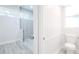 Bright bathroom featuring a modern shower with glass door and white fixtures at 8023 Canyon Lake Cir, Orlando, FL 32835