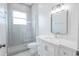 Modern bathroom with a glass-enclosed shower, white vanity, and stylish fixtures at 8023 Canyon Lake Cir, Orlando, FL 32835