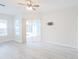 Bright bedroom with an outdoor view, ceiling fan, and a sliding glass door at 8023 Canyon Lake Cir, Orlando, FL 32835