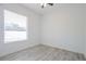 Clean bedroom with sleek floor and window bringing in natural light at 8023 Canyon Lake Cir, Orlando, FL 32835
