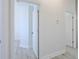Bright hallway with open doorways and neutral decor, creating an inviting atmosphere at 8023 Canyon Lake Cir, Orlando, FL 32835