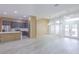 Modern open kitchen and living space with stainless appliances, island, and ample natural light at 8023 Canyon Lake Cir, Orlando, FL 32835