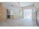 Open concept living area with a fireplace, access to the backyard, and natural lighting at 8023 Canyon Lake Cir, Orlando, FL 32835