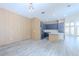 Spacious living area with light wood floors, modern kitchen, and ample natural light at 8023 Canyon Lake Cir, Orlando, FL 32835
