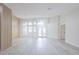 Bright open-concept living room with modern lighting, hardwood floors, and large windows at 8023 Canyon Lake Cir, Orlando, FL 32835