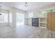 Bright living room with a fireplace, open shelving, large windows, and pool views at 8023 Canyon Lake Cir, Orlando, FL 32835