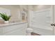Bathroom features a tub-shower combo, modern vanity, and decorative wall art at 1068 Clay Blvd, Tavares, FL 32778