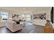 Bright living room with hardwood floors, modern decor, and sliding glass doors for natural light at 1076 Clay Blvd, Tavares, FL 32778