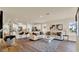 Open-concept living space with a kitchen and hardwood floors, plenty of natural light at 1076 Clay Blvd, Tavares, FL 32778