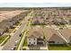 Aerial view showcasing the home's backyard, the surrounding neighborhood, and nearby street at 1103 Silo Dr, St Cloud, FL 34771